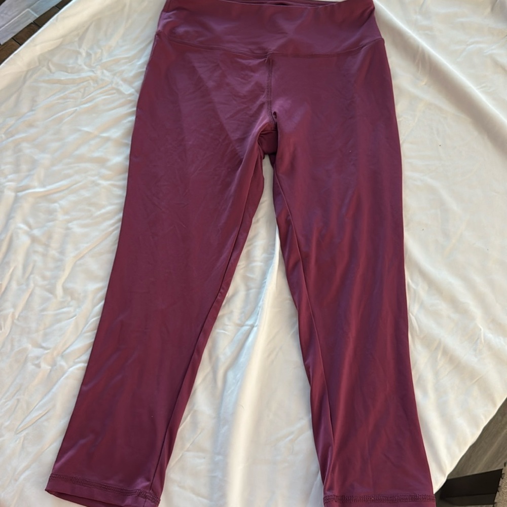 Never worn purpleish, legging size medium